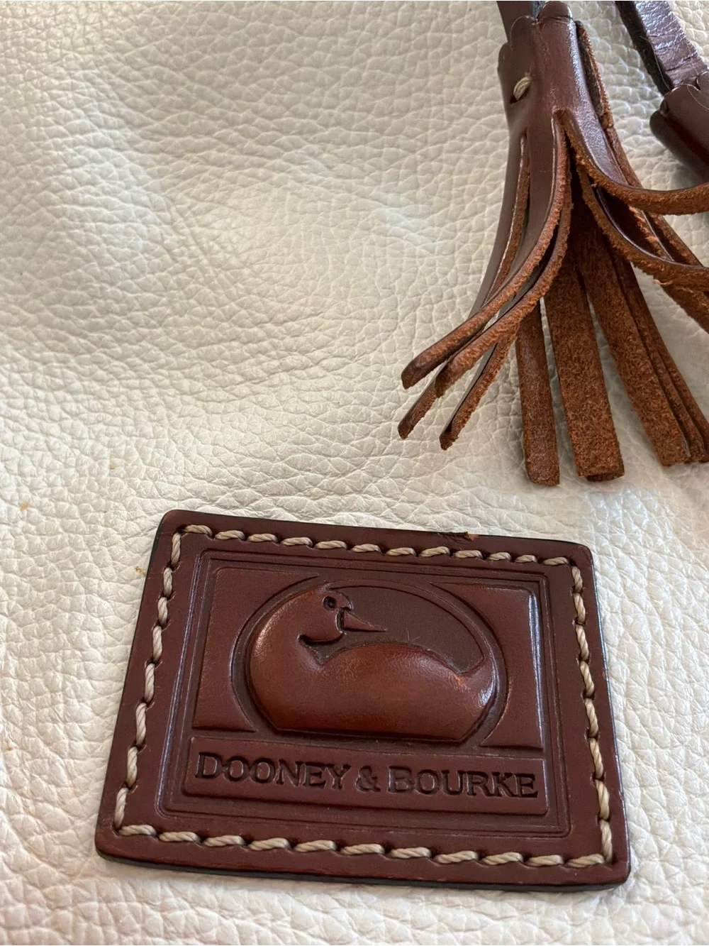 Dooney & Bourke White Pebbled Leather Satchel with Brown Trim and Tassel